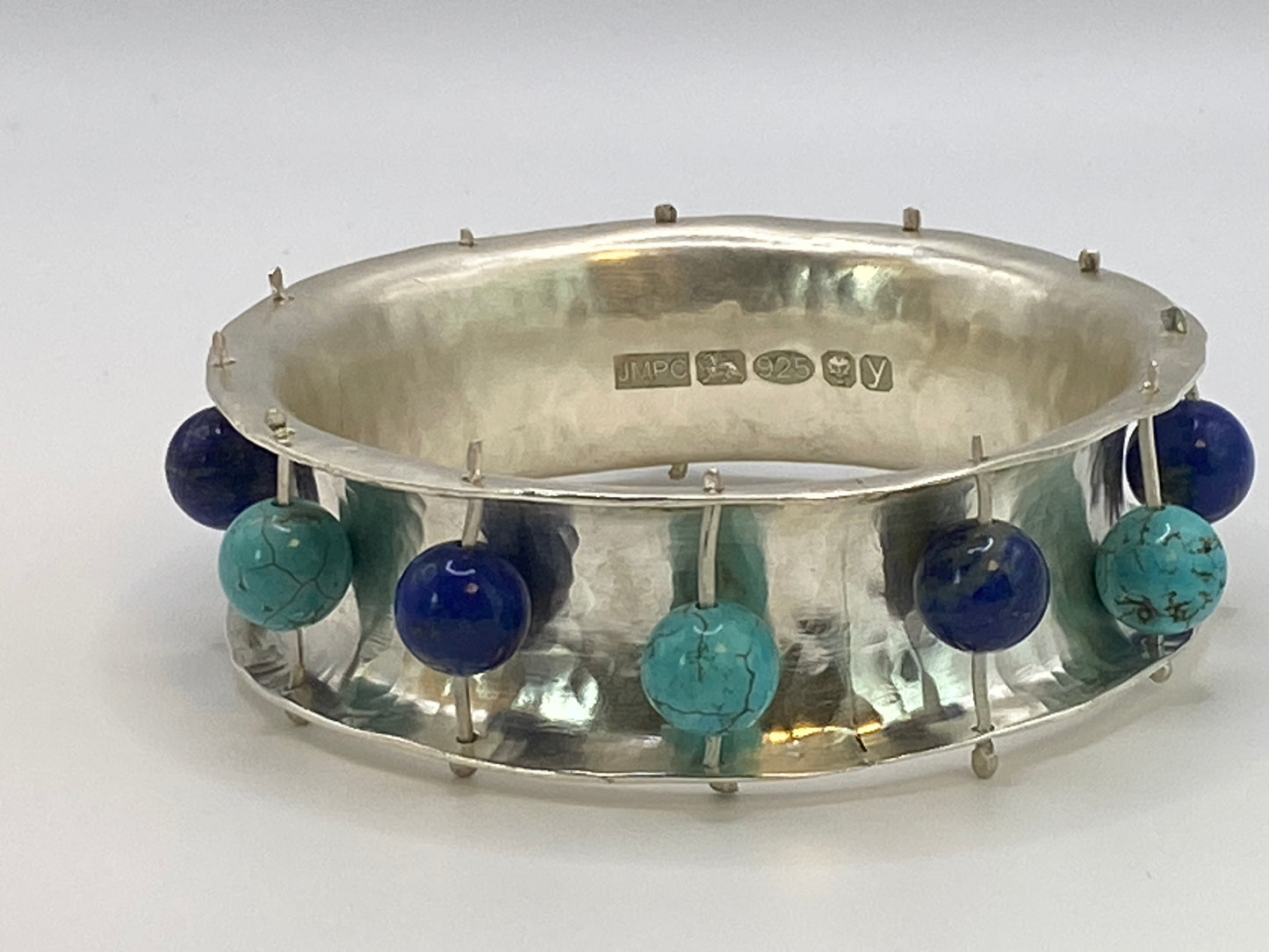 Hand forged U section hallmarked silver Sterling bracelet with turquoise and lapis stones