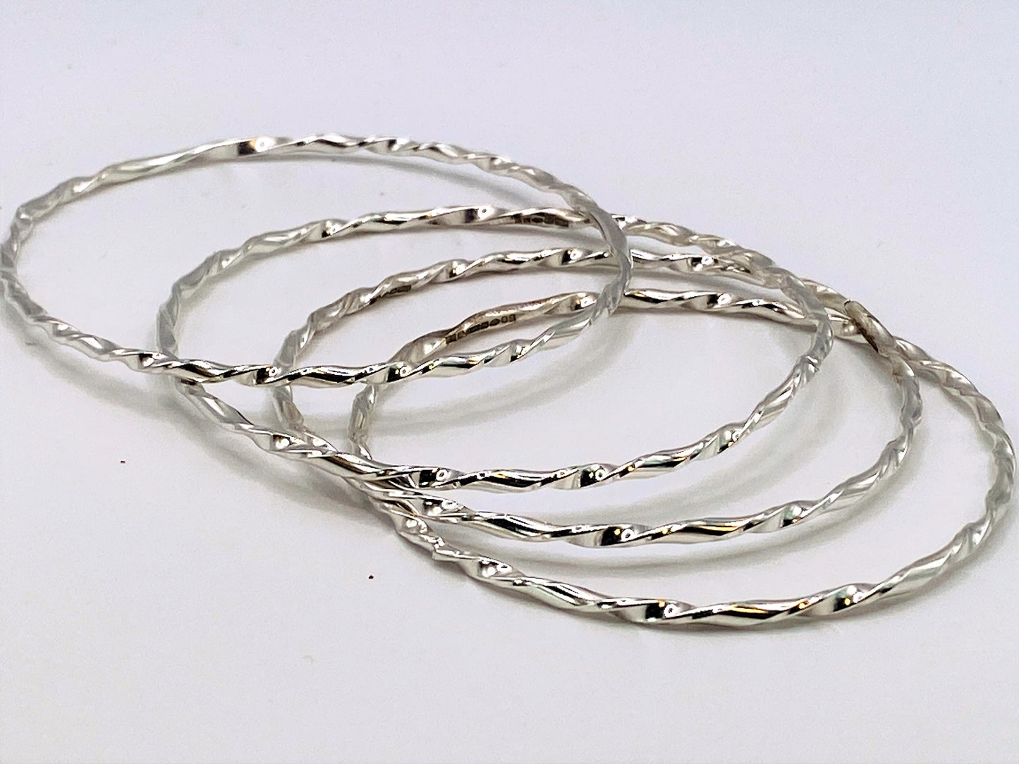 Hand made twisted D section hallmarked silver sterling bangles